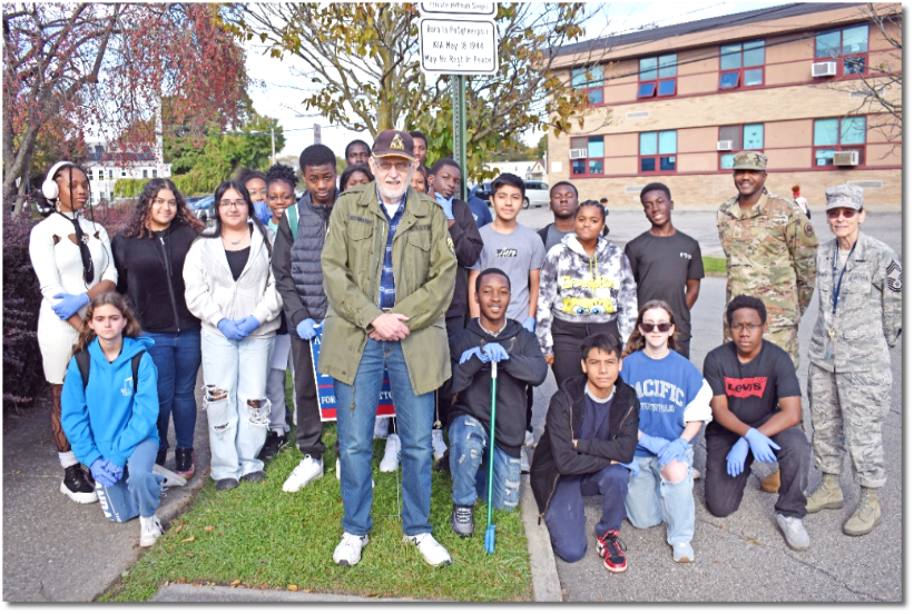 Title: Air Force Junior Reserve Officer Training Corps - Description: Air Force Junior Reserve Officer Training Corps students and instructors pose with Jewish War Veterans Private Herman Siegel Post 625 Chief Martin Hochhauser in front of a sign honoring the PHS student who died in action during World War II.